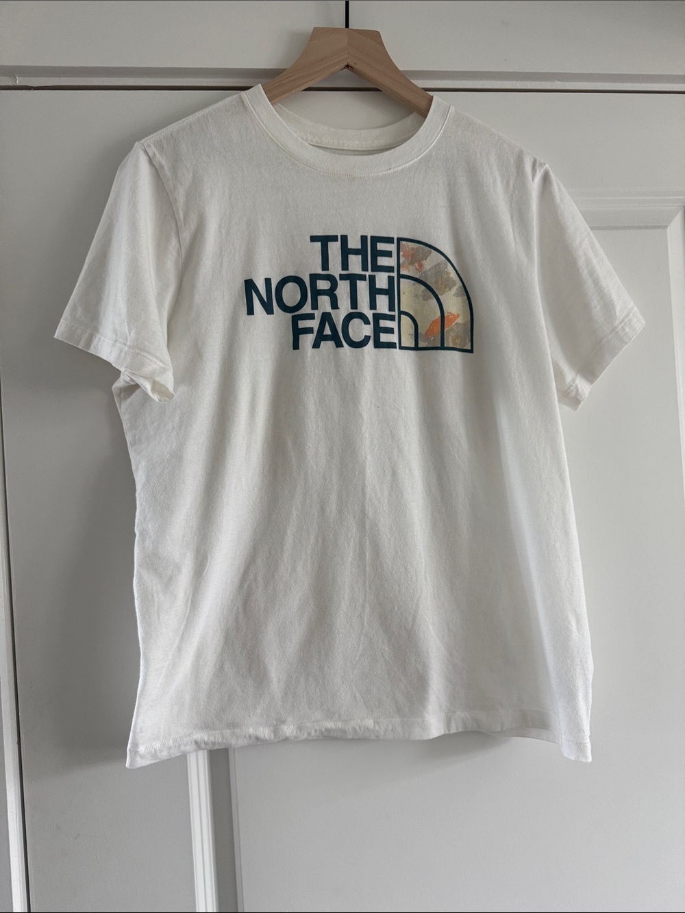 The North Face White Short Sleeve Tee with Navy Logo and Floral Accent Panel